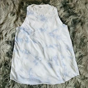 SoulCycle tank w/blue & white tie dyed pattern and skull logo on the front